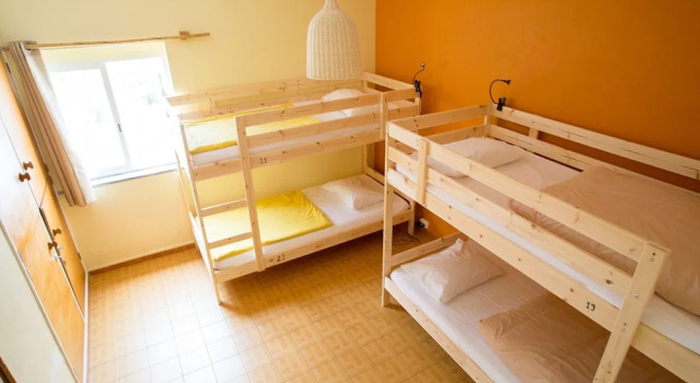 Кровать в общем номере Good Feeling Hostel & Guest House