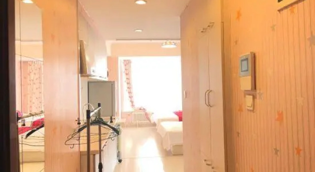 Кровать в общем номере Meijiahua Hotel Apartment Dalian
