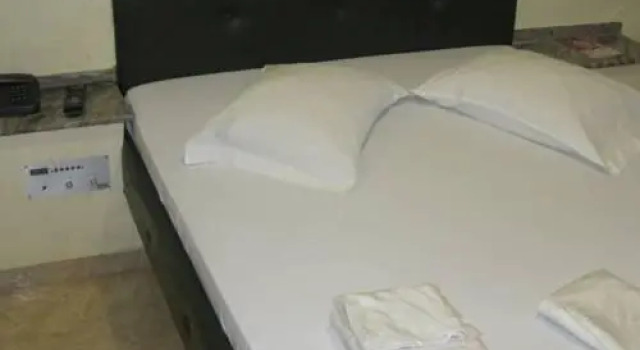 Кровать в общем номере Pompeu Rio Hotel