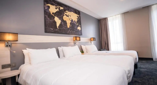 Трёхместный номер Hôtel Univers