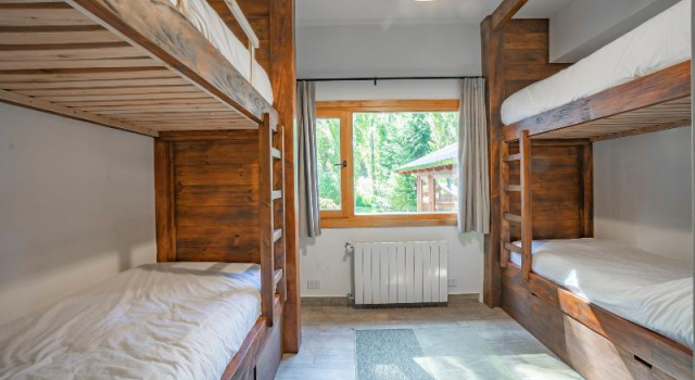 Кровать в общем номере с 6 комнатами Villa Labrador Bariloche