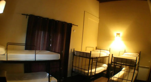 Кровать в общем номере Casa Barbadelo