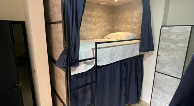 Кровать в общем номере HOSTAL XAO
