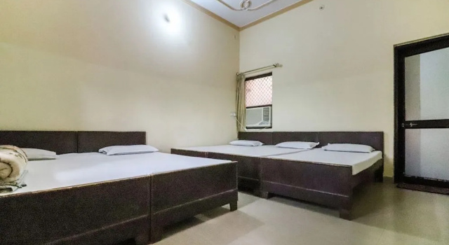 Shri Giriraj Dham by OYO Rooms