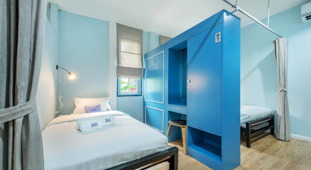 Кровать в общем номере Visut House