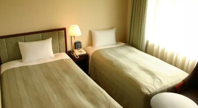 Кровать в общем номере HOTEL JAL City Tsukuba