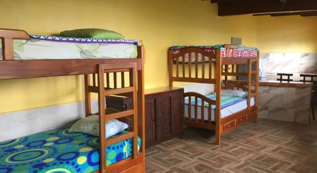 Кровать в общем номере Mirador Finca Morrogacho