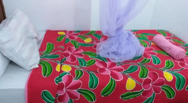 Кровать в общем номере Amed Sari Beach Guesthouse