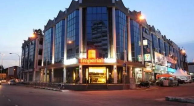 Кровать в общем номере The Imperial Hotel