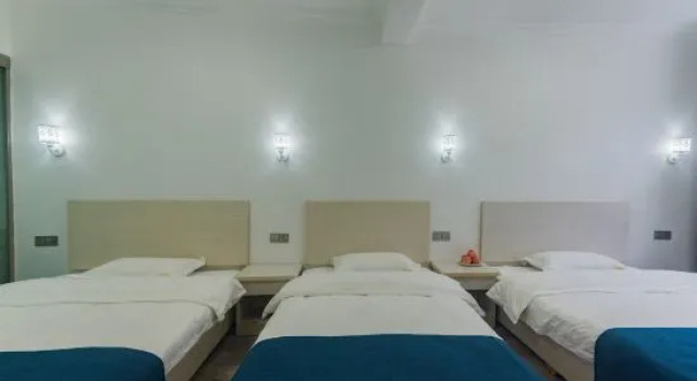 Кровать в общем номере Xushi Inn, Jixian