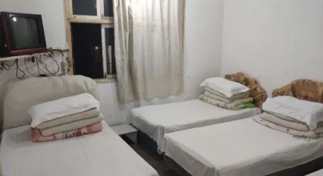 Кровать в общем номере Yueqing Xinli Hotel