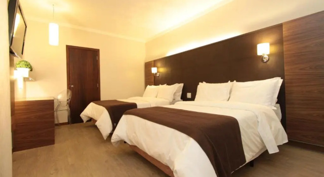 Четырёхместный номер Deluxe Oasis Tower Hotel