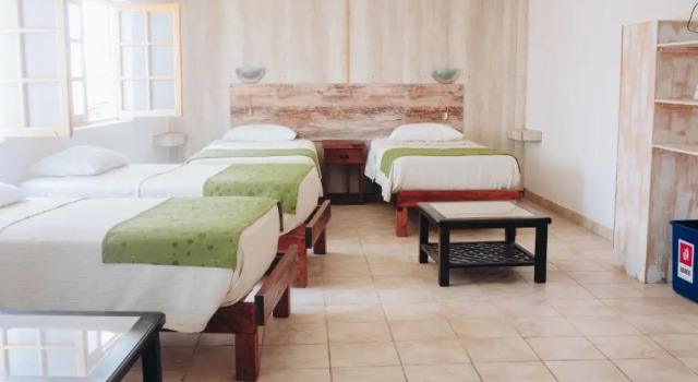 Кровать в общем номере с красивым видом из окна Hostal Valle Mistral