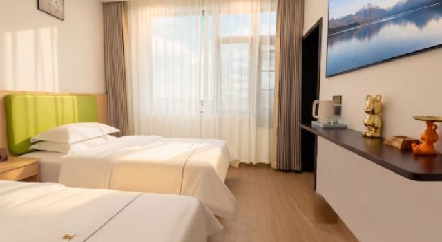 Кровать в общем номере Charlotte Boutique Hotel Shanghai Zhoupu Wanda
