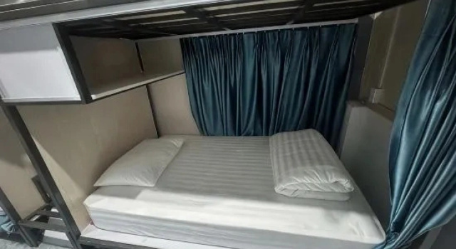 Кровать в общем номере Son Tinh Hotel