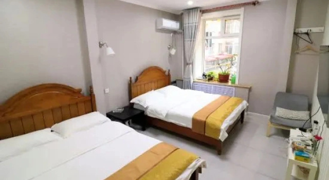 Pat în dormitor Huayi Hostel