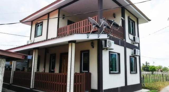 OYO Home 90389 Haji Hassan Guesthouse, Boek Hotel Pantai Cenang 