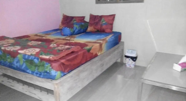 Кровать в общем номере Yunior Guesthouse