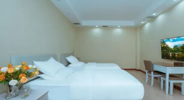 Двухместный семейный люкс с балконом Weiyuna Hotel (XiShuangBanNaMenghai)