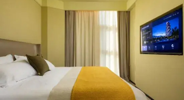 Люкс Deluxe Qishe Hotel (Wanda Plaza Yunjin Road Subway Station)