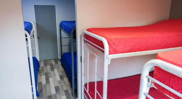 Кровать в общем номере Aji Hostel Providencia
