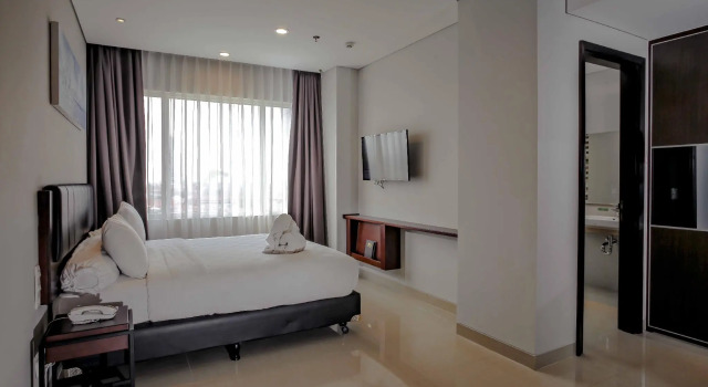 Camera Deluxe PrimeBiz Hotel Surabaya