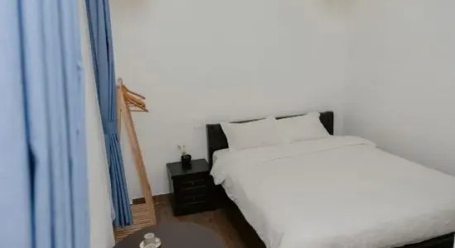 Кровать в общем номере Michelia Valley Hotel