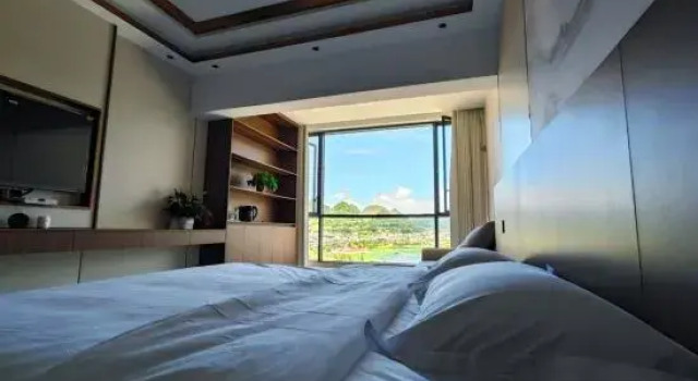 Кровать в общем номере Hongfurong Hotel