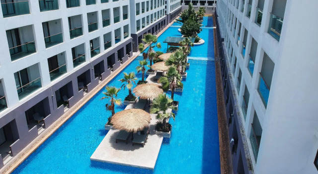 Кровать в общем номере Woraburi The Ritz Resort & Spa