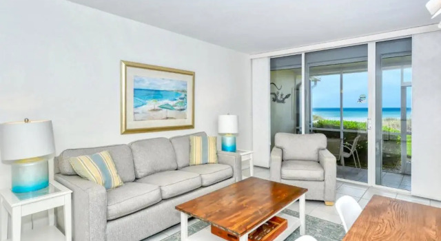 LaPlaya 101A Step out to the beach from your screened lanai Light and bright end unit