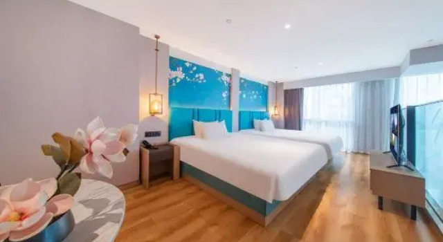 Четырёхместный люкс Дуплекс Yulan Hotel (Longtingju)