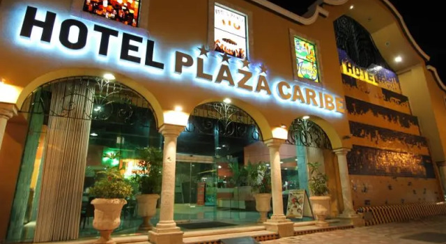 Кровать в общем номере Hotel Plaza Caribe