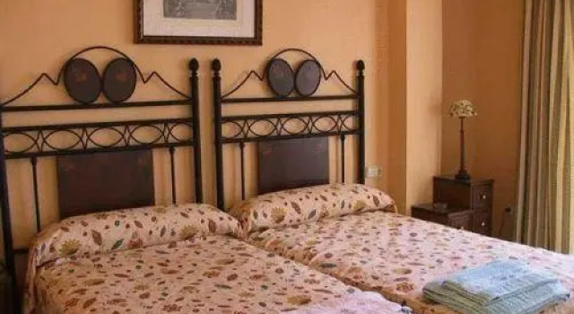 Кровать в общем номере с 2 комнатами Apartahotel Vistamar San José