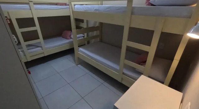 Кровать в общем номере Star Hospedaria