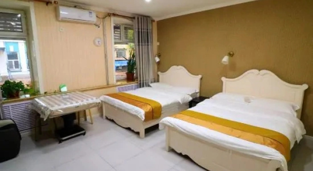 Łóżko w pokoju wieloosobowym Huayi Hostel