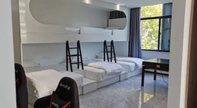 Кровать в общем номере Watchers E-sports Homestay (Huai'an Suning Plaza Xinya Plaza)