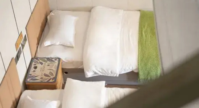 Кровать в общем номере Sanwild Nature Resort Homestay (Kanas Old Village Branch)