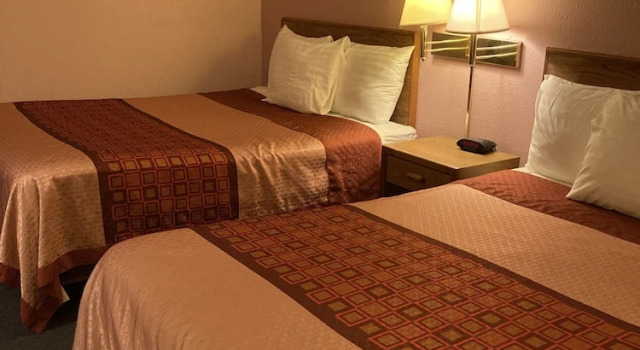 Camera quadrupla Luxury con vista sul giardino Executive Inn