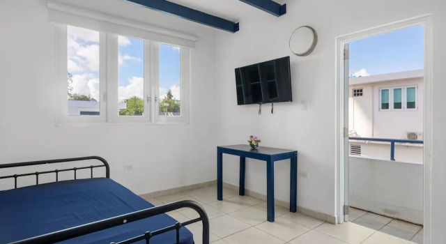 Puerto Rico Beach Rental w Pool Balcony Otium Rentals, Забронировать Апартаменты/квартира Апартаменты Сан-Хуан, рядом с Barbosa Park, Апартаменты/квартира