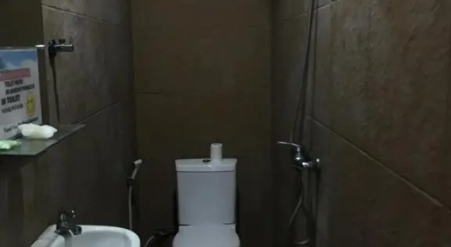 Кровать в общем номере Turtle Island Homestay