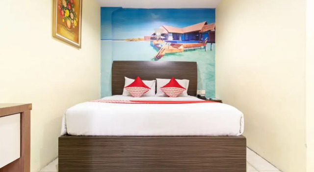 Номер Deluxe Capital O 2023 Medan Ville Hotel