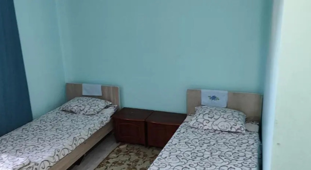 Кровать в общем номере Азия Hotel