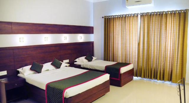 Трёхместный номер Deluxe Bhasuri Inn Guruvayoor