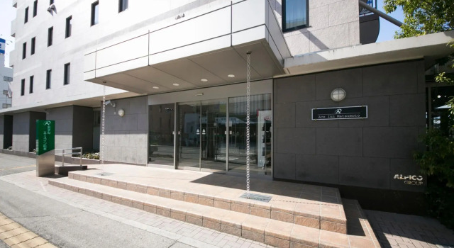 Кровать в общем номере Ace Inn Matsumoto