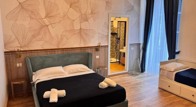 Четырёхместный номер Deluxe с балконом и с видом на море B&B Vitruvio Suites