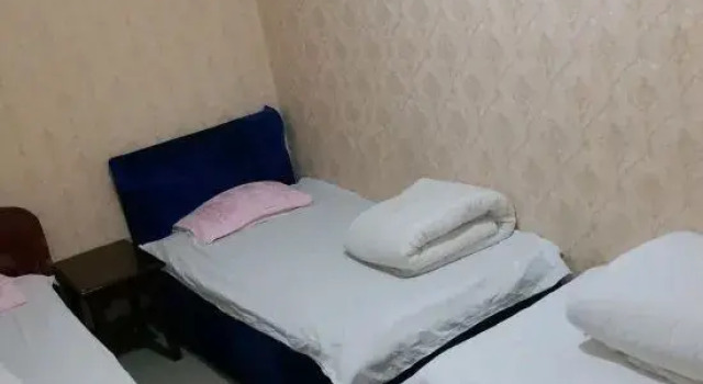 Korla Zhongxin Guest House, Rezerwuj Pensjonat Hotele w Korla z parkingiem, Parking