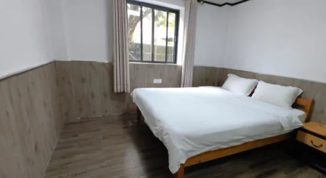 Кровать в общем номере с 6 комнатами Yueshan Tinghai B&B