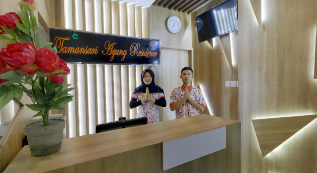 Кровать в общем номере Tamansari Agung Residence