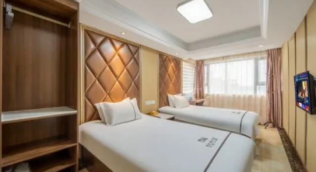 Кровать в общем номере TaoranjuHotel