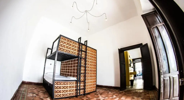 Кровать в общем номере Gente de Más Bnb